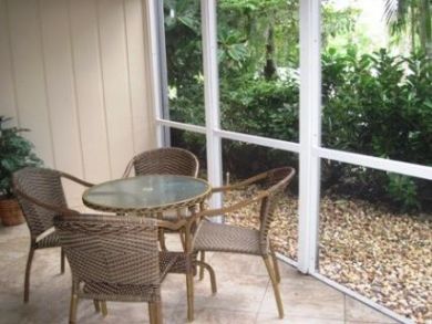 Screened porch with table set